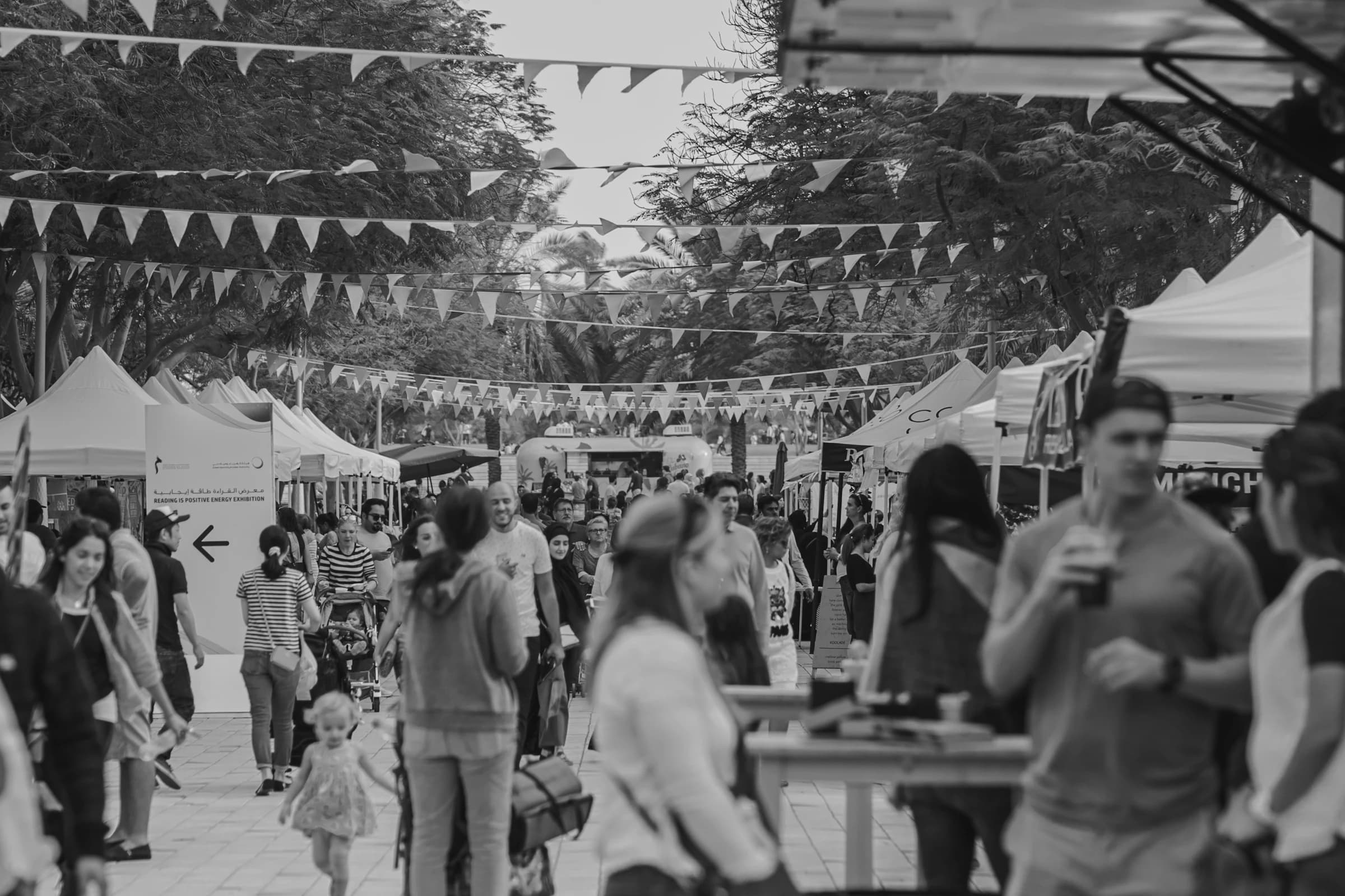 Guests mingling at an outdoor festival event