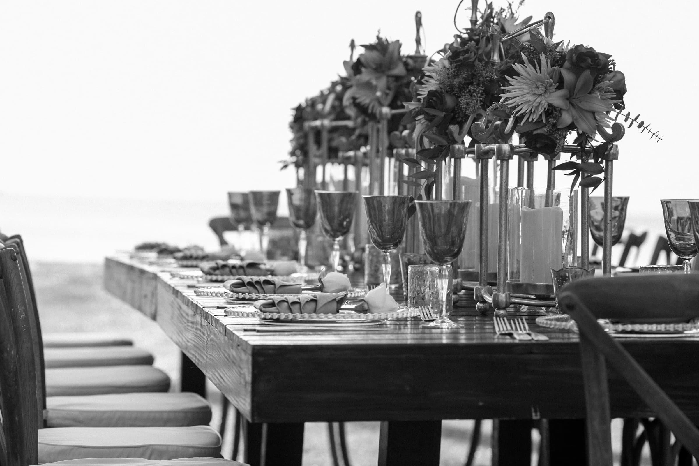 Elegant floral table setting at an outdoor wedding
